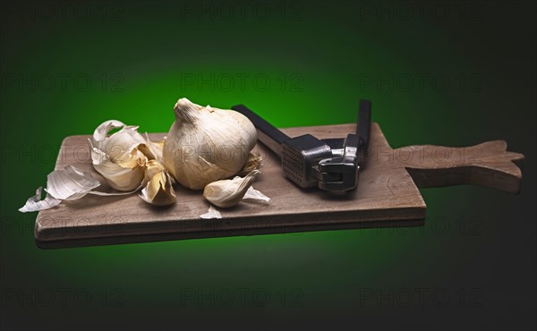 Decoration with garlic and garlic press