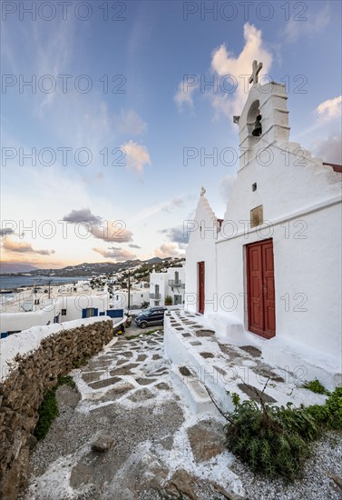 White Cycladic Greek Orthodox Twin Churches of Agios Antonios and Agios Nikolaos at sunrise