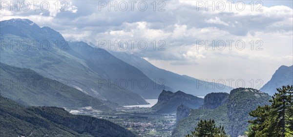 View into the Sarca Valley towards Lake Garda with rocks of Castello di Arco
