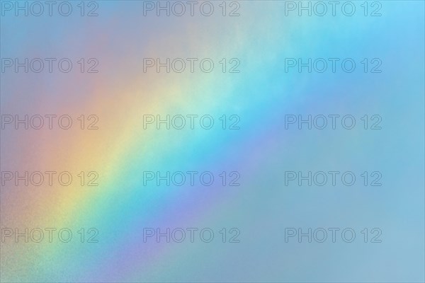 Rainbow colours in the water flow of an agricultural sprinkler system. Bas-Rhin