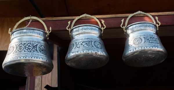 Little set of buckets of made of metal in a market place