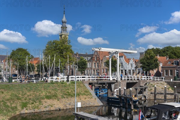 Cityscape at the marina with Queen Beatrix Bridge and historic town hall