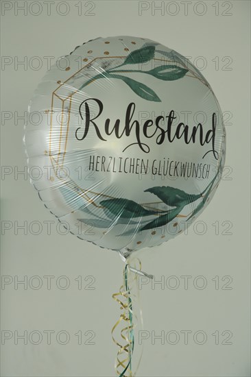 Balloon with inscription retirement and congratulations