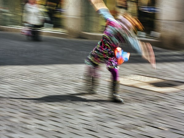 Colourful clown doing a cartwheel