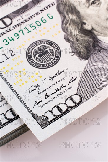 American 100 dollar banknotes made of paper placed on white background
