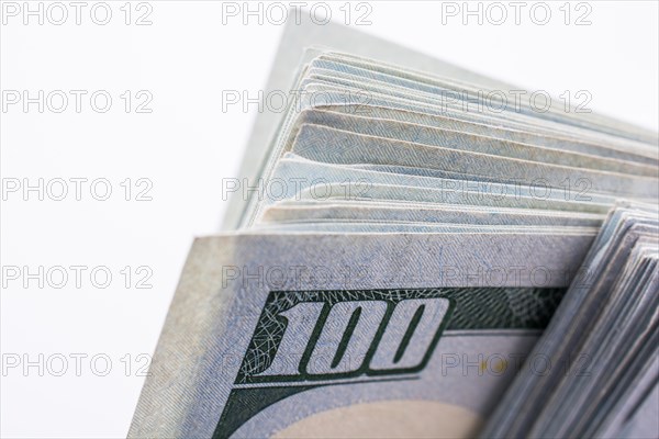 American 100 dollar banknotes made of paper placed on white background