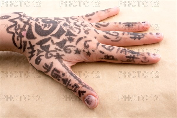 Hand with tattoo on a background