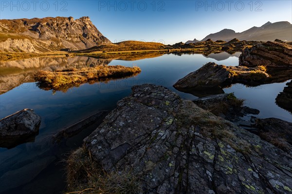 The Blue Lake at sunrise near Melchsee-Frutt on the Aa Alp in the Melch Valley