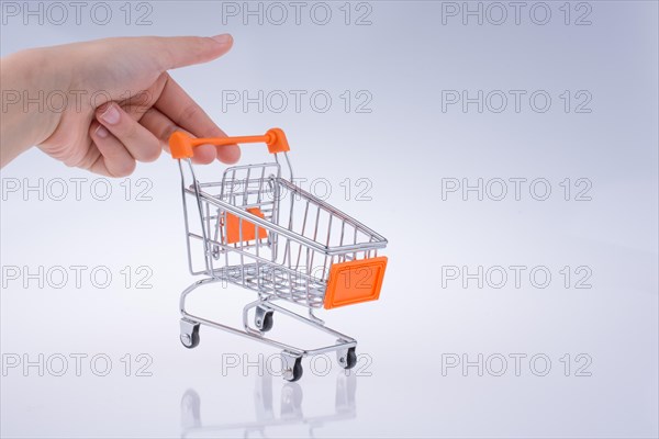 Hand holding a Cart on a white background