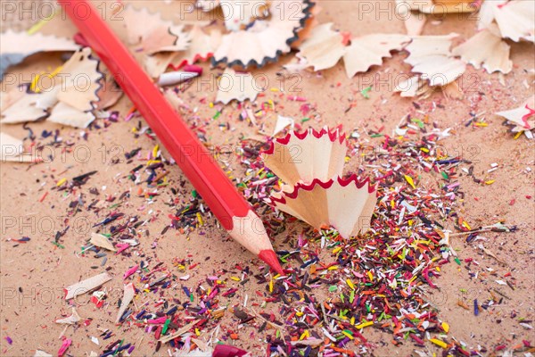 Red Color Pencil over some pencil shavings
