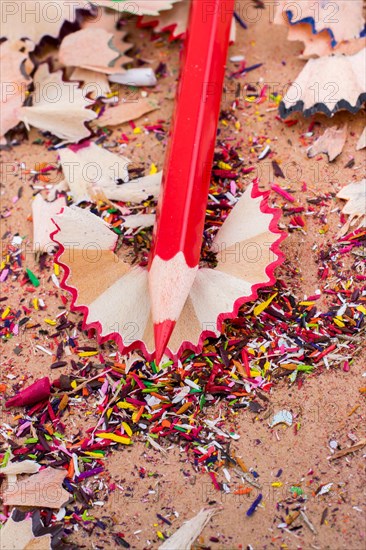 Red Color Pencil over some pencil shavings