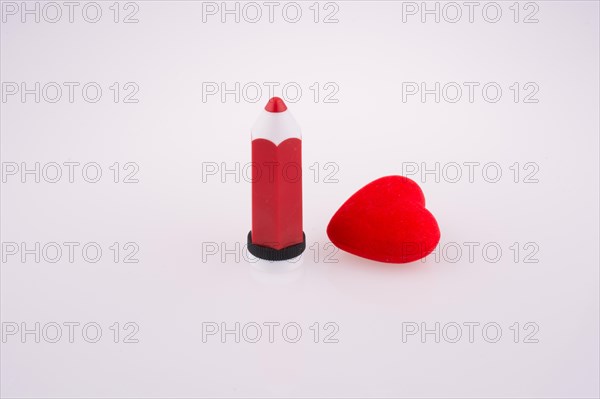 Red heart near a red pen