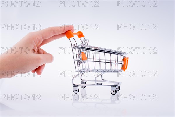 Hand holding a Cart on a white background