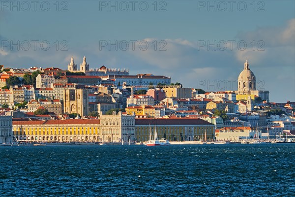 View of Lisbon over Tagus river from Almada with yachts tourist boats on sunset. Lisbon