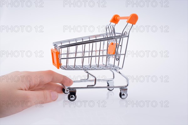 Hand holding a Cart on a white background