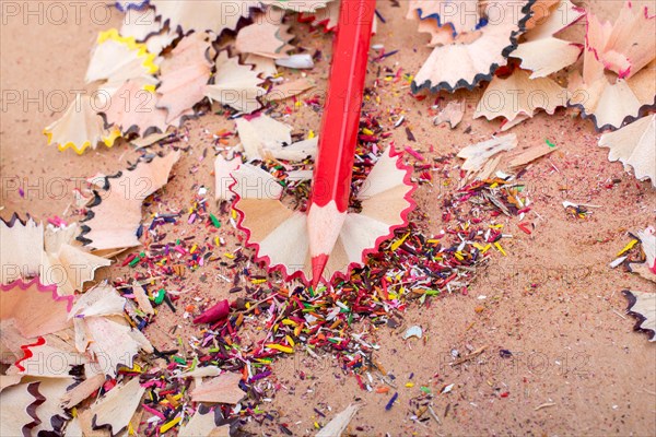Red Color Pencil over some pencil shavings