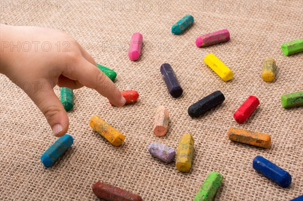 Used color crayons and a toddlers hand pointing