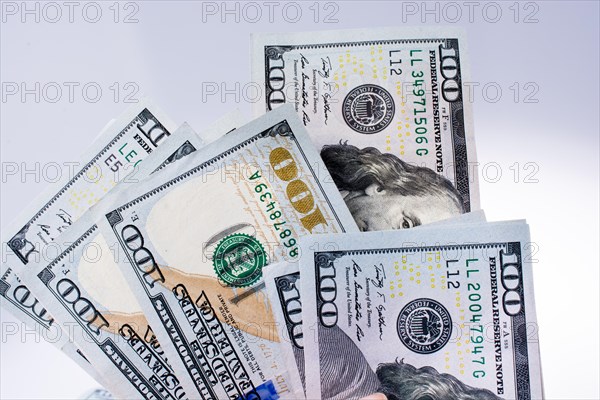 American 100 dollar banknotes made of paper placed on white background