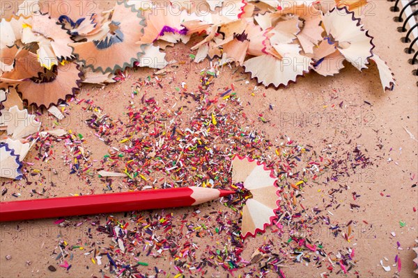Red Color Pencil over some pencil shavings