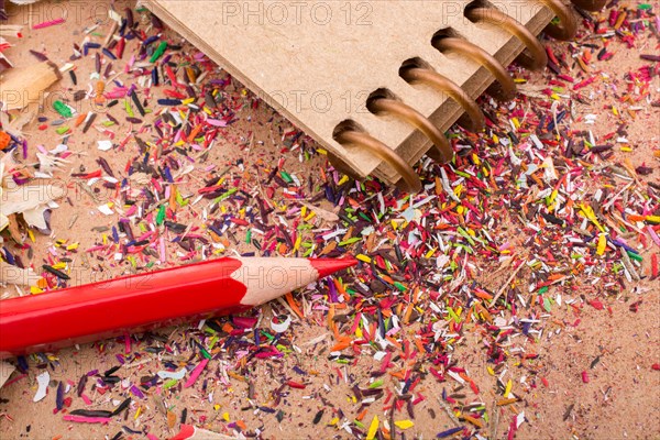 Red Color Pencil over some pencil shavings