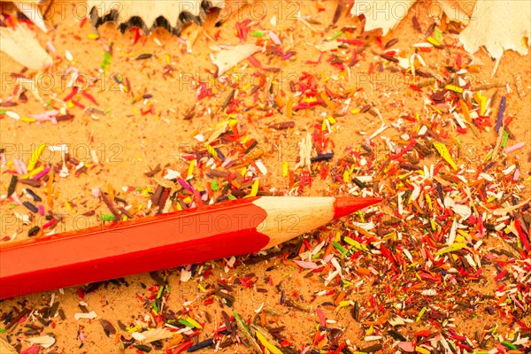 Red Color Pencil over some pencil shavings