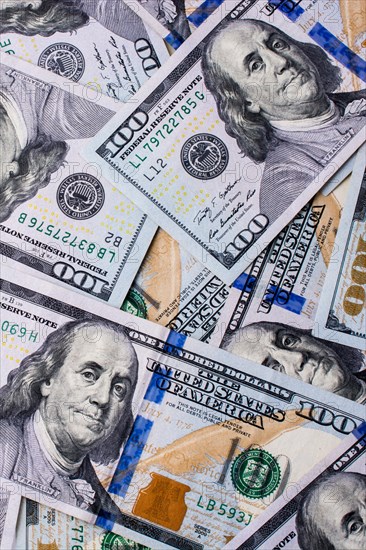 American 100 dollar banknotes made of paper placed on white background
