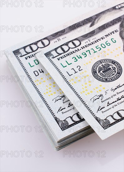 American 100 dollar banknotes made of paper placed on white background