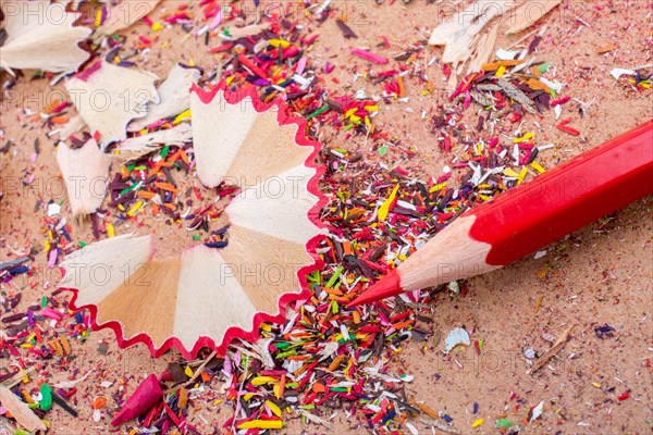 Red Color Pencil over some pencil shavings