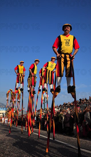 Stilt walkers in the street parade in Menton