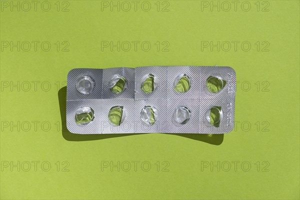 Empty tablet blister pack against a monochrome background