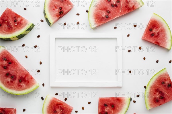 Flat lay sliced watermelon white background with frame