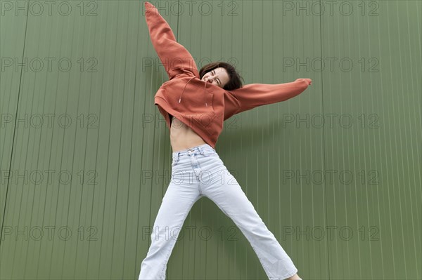 Portrait young beautiful female jumping 1