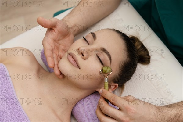 Close up hand holding face tool