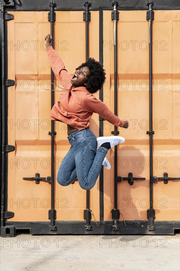Portrait young female jumping 1