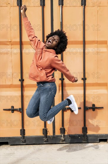 Portrait young female jumping 3
