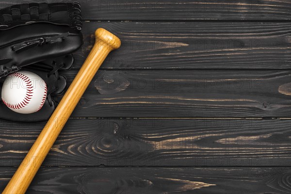 Flat lay baseball bat with glove ball