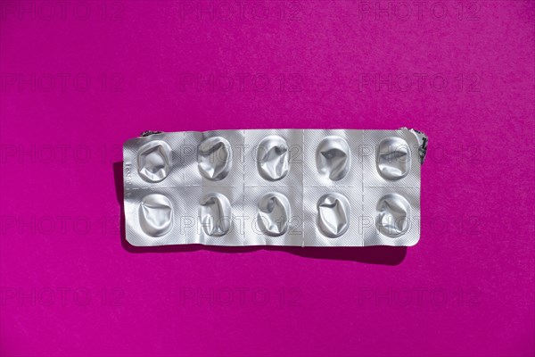 Empty tablet blister pack against a monochrome background