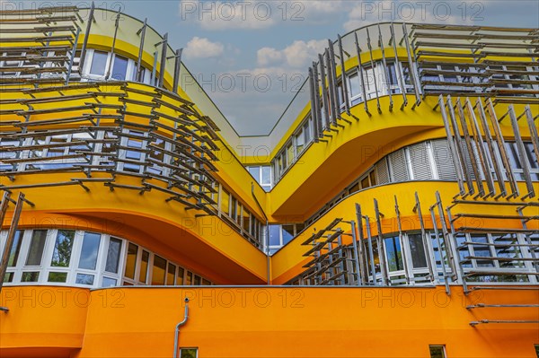 Modern building with pastel-coloured facade