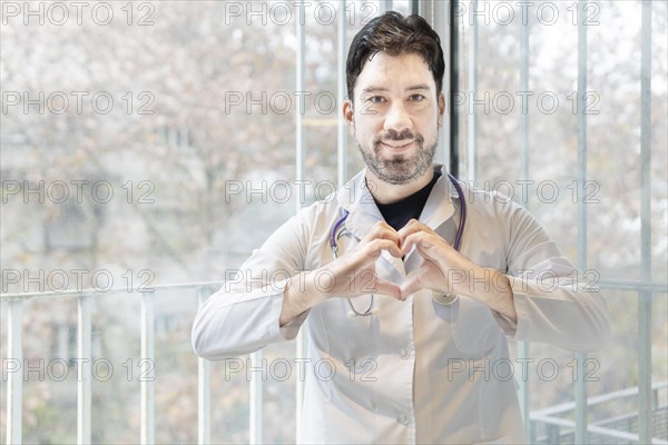 Latin cardiologist smiling at the camera