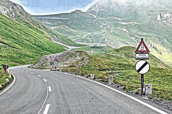 Photo with reduced dynamic range saturation HDR with view of from mountain pass alpine mountain road alpine road pass road pass old Grossglockner High Alpine Road Grossglockner High Alpine Road above ...