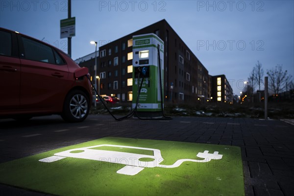 An e-car charges at a public charging station in Duesseldorf