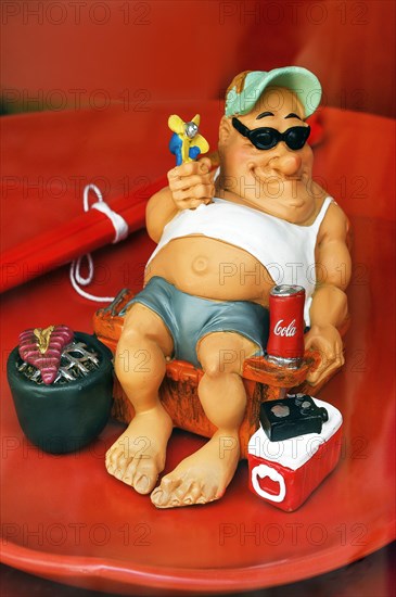 Shop window with funny ceramic figure