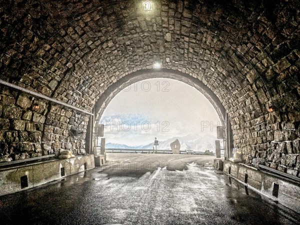 Photo with reduced dynamic saturation HDR of mountain pass alpine mountain road alpine road pass road pass view from tunnel Hochtor of Grossglockner High Alpine Road Grossglockner High Alpine Road in ...