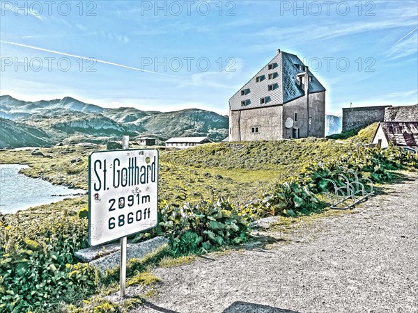 Photo with reduced dynamics saturation HDR of view to the left at the edge of the picture mountain lake in the foreground sign for pass Sankt St Gotthard Gotthard pass 2091 metres altitude high mounta...