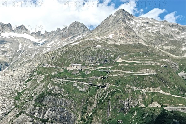 Photo with reduced dynamics saturation HDR of mountain pass alpine mountain road alpine road pass road pass Furkapass with serpentines