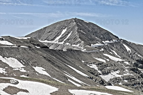 Photo with reduced dynamic saturation HDR of mountain pass alpine mountain road alpine road pass road pass view of highest asphalted alpine road ring road around Cime de la Bonette Col de la Bonette i...