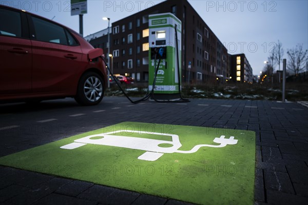 An e-car charges at a public charging station in Duesseldorf