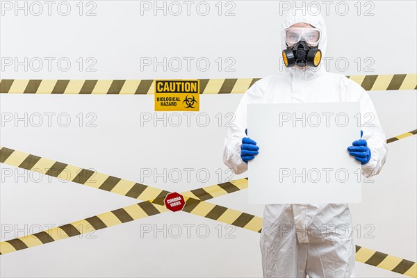 Man hazmat suit with blank sign