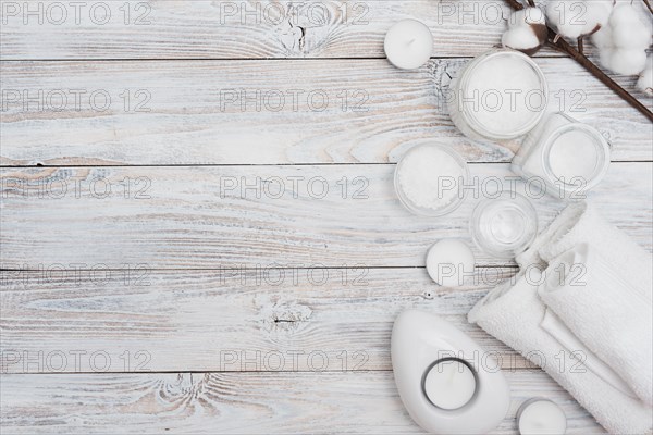 Bath salts cotton flowers wooden background