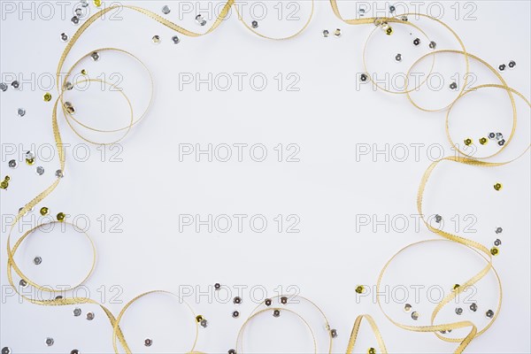 Decorative ribbon near colourful confetti